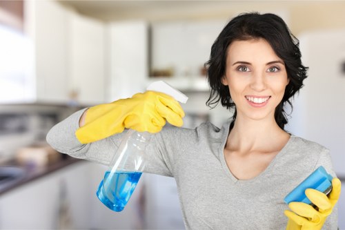 Professional oven cleaner cleaning a built-in oven in an E17 home